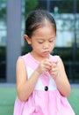The gestures of children who lack confidence. Child girl intend her fingers