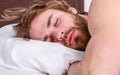 Get adequate and consistent amount of sleep every night. Expert tips on sleeping better. Bearded man sleeping face Royalty Free Stock Photo