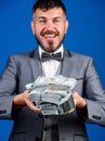 Get cash easy and quickly. Cash transaction business. Man happy winner rich hold pile of dollar banknotes blue Royalty Free Stock Photo