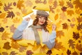Get comfy wearing this fantastic scarf. Casual fashion trends for fall. Fashion girl look through torn paper with autumn Royalty Free Stock Photo