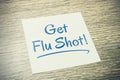 Get Flu Shot Reminder On Paper On Wooden Table Royalty Free Stock Photo