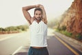 Get focused, get running. Portrait of a young man stretching before going for a run.