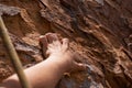 Get a grip. Closeup of a rock climber holding on to a rockface. Royalty Free Stock Photo