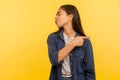 Get out, leave me! Portrait of annoyed vexed girl in denim shirt pointing way out and turning away Royalty Free Stock Photo