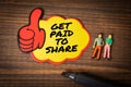 Get Paid To Share. Sticky note with text on wood texture background