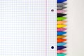 Unlimited creativity: Colored crayons and notebook sheet for colorful back-to-school