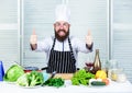 Get ready. Man bearded chef getting ready cooking delicious dish. Chef at work starting shift. Guy in professional Royalty Free Stock Photo