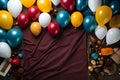 Festive background with colorful balloons, gifts and confetti. Top view with copy space