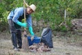 Get rid of dry leaves to make compost or make fire barrier in autumn Royalty Free Stock Photo