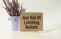 Get Rid Of Limiting Beliefs. text on wood table, on white paper Royalty Free Stock Photo