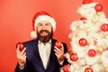 Get into the spirit of the season. Man with beard hold red balls christmas decorations. Winter holidays. Share christmas Royalty Free Stock Photo