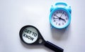 Get to know written on a magnifying glass and a white background with a clock