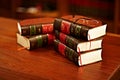 Get to know your rights. a stack of legal books and a pair of glasses on a table in a study. Royalty Free Stock Photo