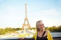 Get the tower in the background please. An attractive young woman sight seeing in the Paris. Royalty Free Stock Photo