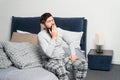 Get up early. Tips for waking up early. Man bearded hipster sleepy face waking up bedroom interior. Schedule for healthy