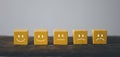 Get valuable feedback and ratings on products and services with this yellow wooden cube icon. Measure customer satisfaction, Royalty Free Stock Photo