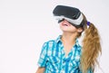 Get virtual experience. Girl cute child with head mounted display on white background. Virtual reality concept. Small