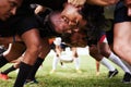 Get in, weve got a game to win. a group of young rugby players in a scrum on the field. Royalty Free Stock Photo