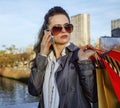 Fashion-monger with shopping bags talking on smartphone, Paris Royalty Free Stock Photo