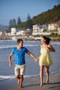 Get your feet wet. an affectionate couple walking on the beach. Royalty Free Stock Photo