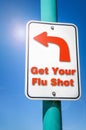 Get Your Flu Shot. Conceptual Sign against Blue Sky