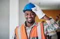 Get your helmets on, weve got work to do. Portrait of a confident young man working at a construction site. Royalty Free Stock Photo