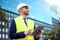 Get your metrics right. a young businessman on a construction site using a digital tablet. Royalty Free Stock Photo