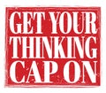 GET YOUR THINKING CAP ON, text on red stamp sign Royalty Free Stock Photo
