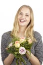 She gets a bouquet of flowers (roses) fpr birthday Royalty Free Stock Photo