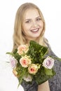 She gets a bouquet of flowers (roses) fpr birthday Royalty Free Stock Photo