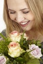 She gets a bouquet of flowers (roses) fpr birthday Royalty Free Stock Photo