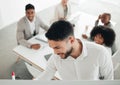 Getting all the best ideas on paper. a young businessman writing on a whiteboard during a meeting at work. Royalty Free Stock Photo