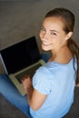 Getting in a bit of surfing. Portrait of a young student working on her laptop. Royalty Free Stock Photo