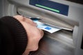 Getting cash at ATM machine Royalty Free Stock Photo