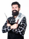 Getting a complete grilling experience. Bearded man holding barbecue grilling tools. Happy hipster using metal grilling Royalty Free Stock Photo