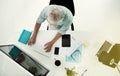 Getting down to business. High angle shot of a mature businessman working on a computer at his desk in an office. Royalty Free Stock Photo