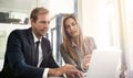 Getting down to business. a two executives working together in an office. Royalty Free Stock Photo