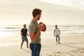 Getting fit the fun way. a group of happy young friends playing with a ball on the beach. Royalty Free Stock Photo