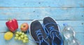 Getting fit and reducing weight for the springtime, pair of runners and fruit,free copy space,flat lay