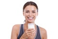 Getting her daily calcium. Portrait of an attractive young woman holding a glass of milk.