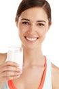 Getting her daily dose of calcium. a beautiful young woman with a glass of milk in her hand.