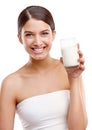 Getting her daily dose of calcium. Studio portrait of an attractive young woman holding a glass of milk. Royalty Free Stock Photo