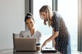 Getting her thoughts. two attractive young businesswomen working in a modern office. Royalty Free Stock Photo