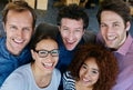 Getting the job done with a smile. Closeup portrait of a group of estatic coworkers standing in an office.