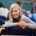 Getting the most out of my college years. Portrait of a young university student sitting in a lecture.