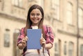 When getting a new book. Happy child show book outdoors. Smart look of cute bookworm. School library. Literature lesson