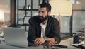 Getting a new podcast off the ground. a young man using a microphone and laptop during a late night at work. Royalty Free Stock Photo