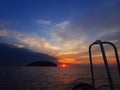 Getting ready for an adventure of night dive with beautiful sunset view on surface. Royalty Free Stock Photo