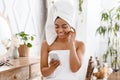 Getting Ready For Date. Black Girl Wrapped In Towel Texting On Smartphone