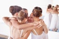 Getting ready for the performance. a group af young ballerinas huddling together in the studio and laughing. Royalty Free Stock Photo